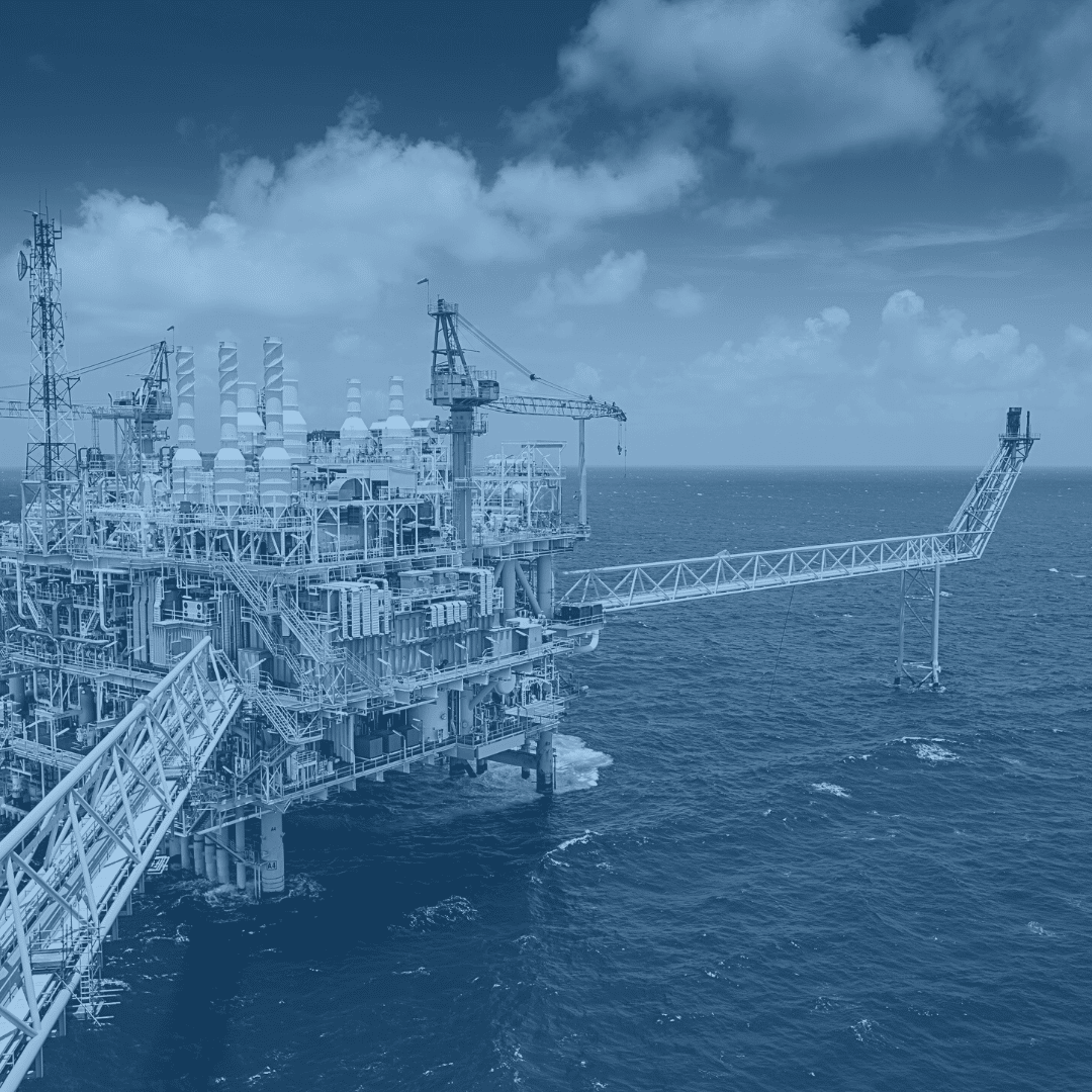 Oil rig in an ocean setting representing the oil and gas industry.