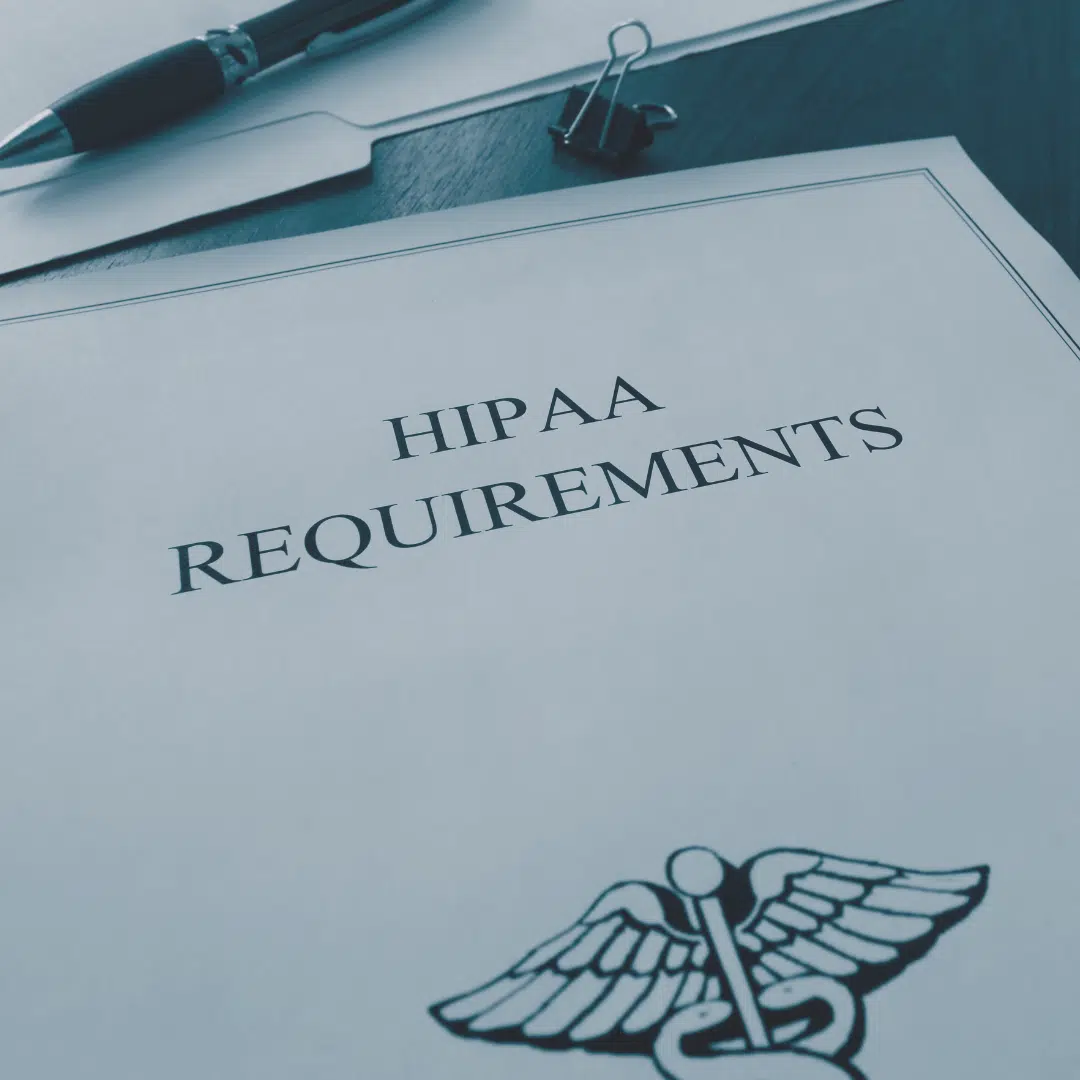 HIPAA requirements document sitting on a desk.