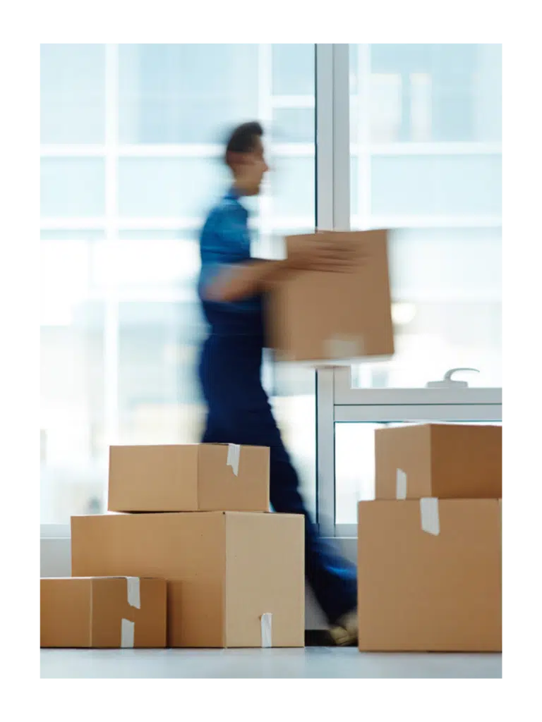 a worker sorting and delivering boxes to their destination