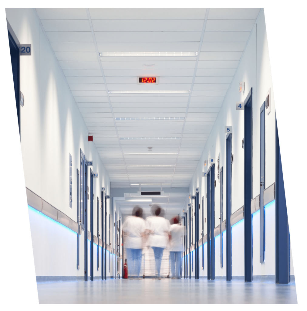 medical workers walking down a hospital hallway