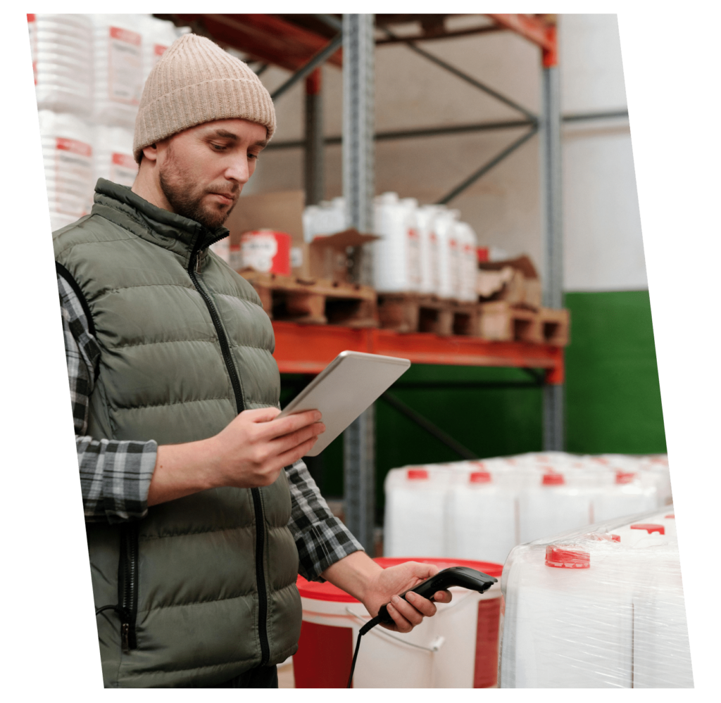 an image of a logistics worker scanning barcodes of an incoming shipment